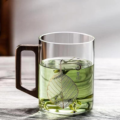 High end green tea cup with walnut handle and lid. High temperature resistant glass