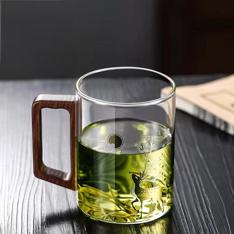 High end green tea cup with walnut handle and lid. High temperature resistant glass