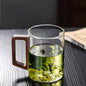 High end green tea cup with walnut handle and lid. High temperature resistant glass