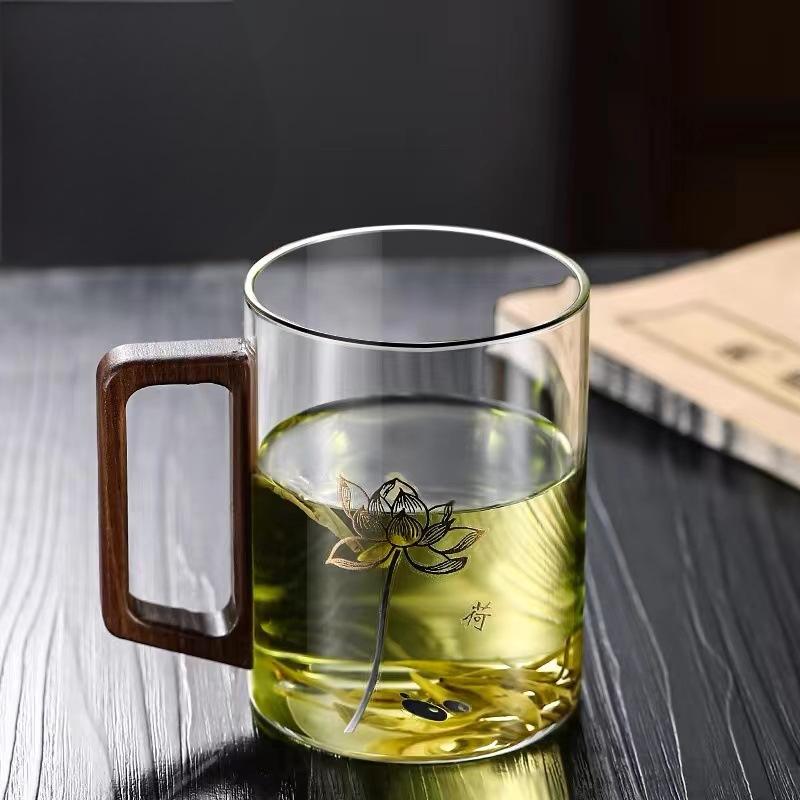 High end green tea cup with walnut handle and lid. High temperature resistant glass