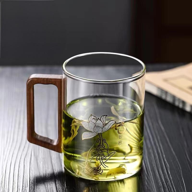 High end green tea cup with walnut handle and lid. High temperature resistant glass